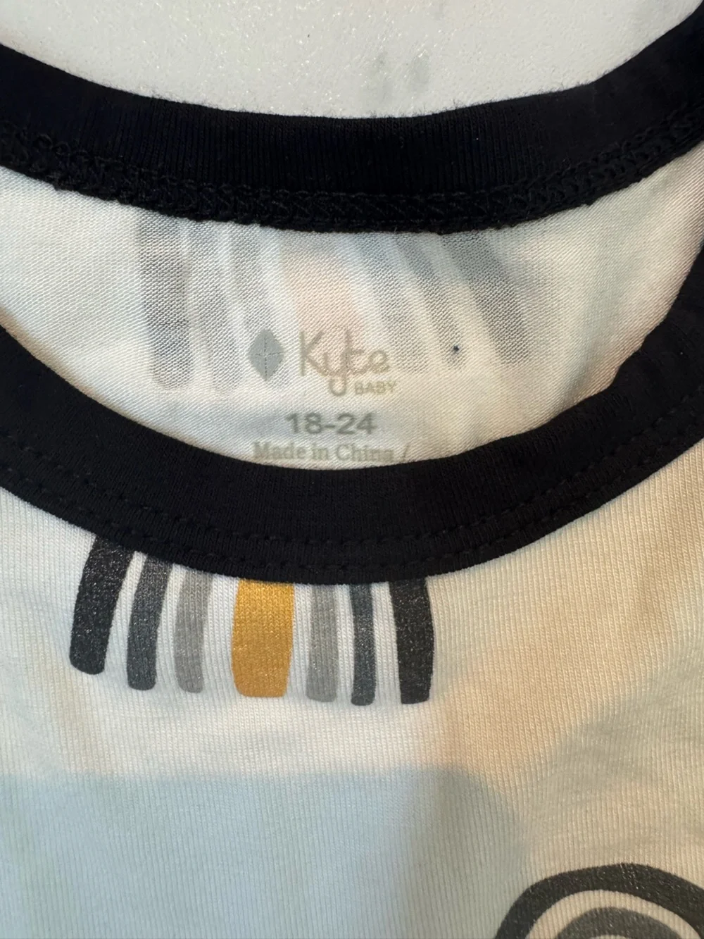Kyte BABY White Dress with Black Trim and Mustard Rainbow Print